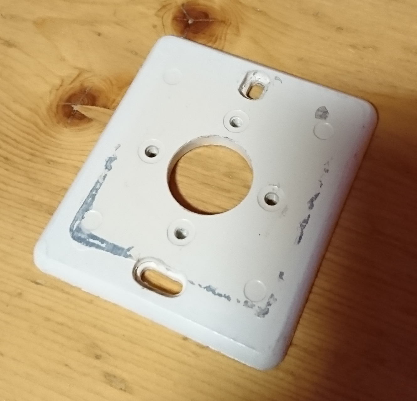 Photo of the old light switches spacer plate.